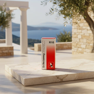 A red and white box of Dr. Reckeweg R10, featuring a red-to-white gradient on the right side, black text on the left, and a small red-and-white icon near the bottom, set against a solid pale pink background.