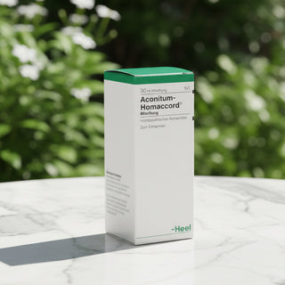 Box of Aconitum Homaccord drops, with green lid on white background, Heel brand.
